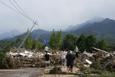 Heavy rains and flooding kill at least 34 people in and near Beijing